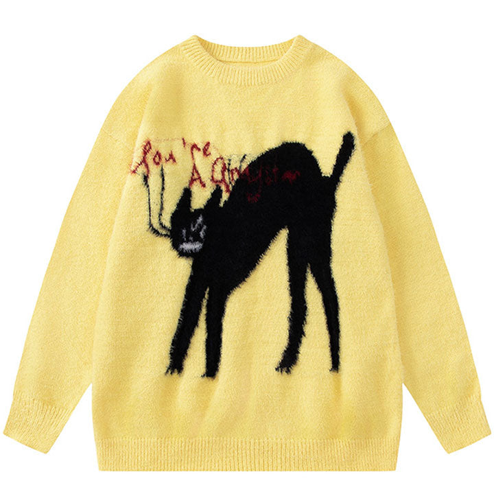 yellow sweater with black cat pattern