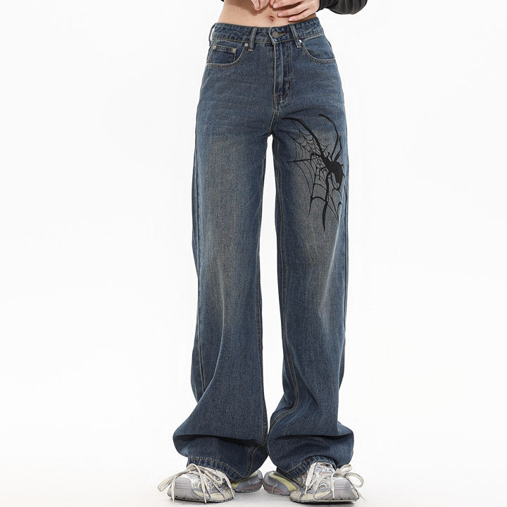 washed denim jeans spider print