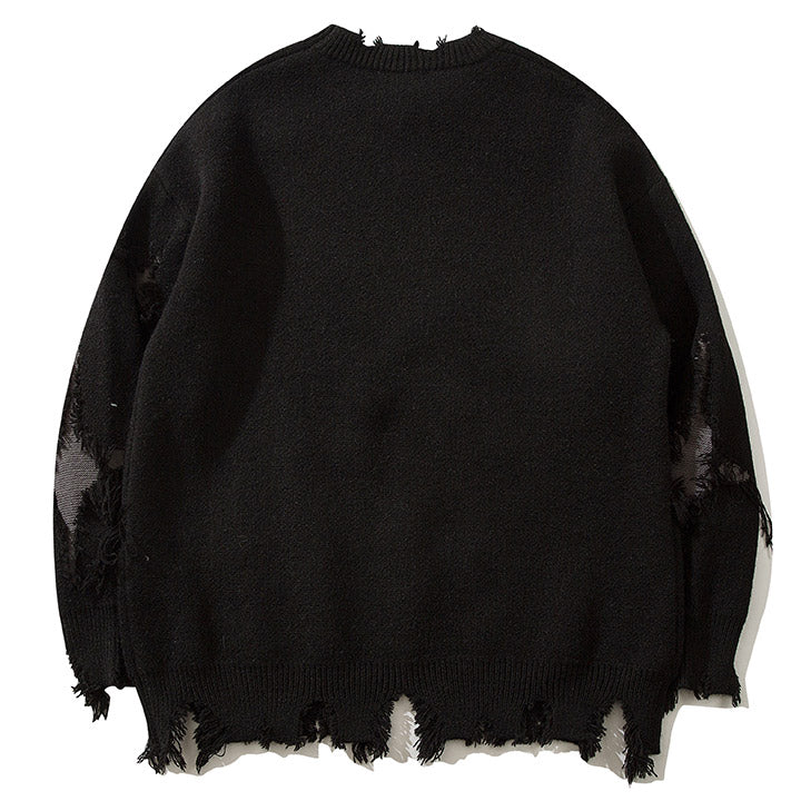 ripped sweater with skull pattern