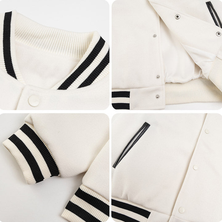 white baseball jacket with black leather patch